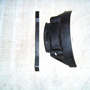 Fan blade shield with a hold down strap.