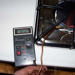 Testing the thermocouple with a DMM.