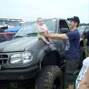 Lilly sitting on Spas's truck at Carlisle